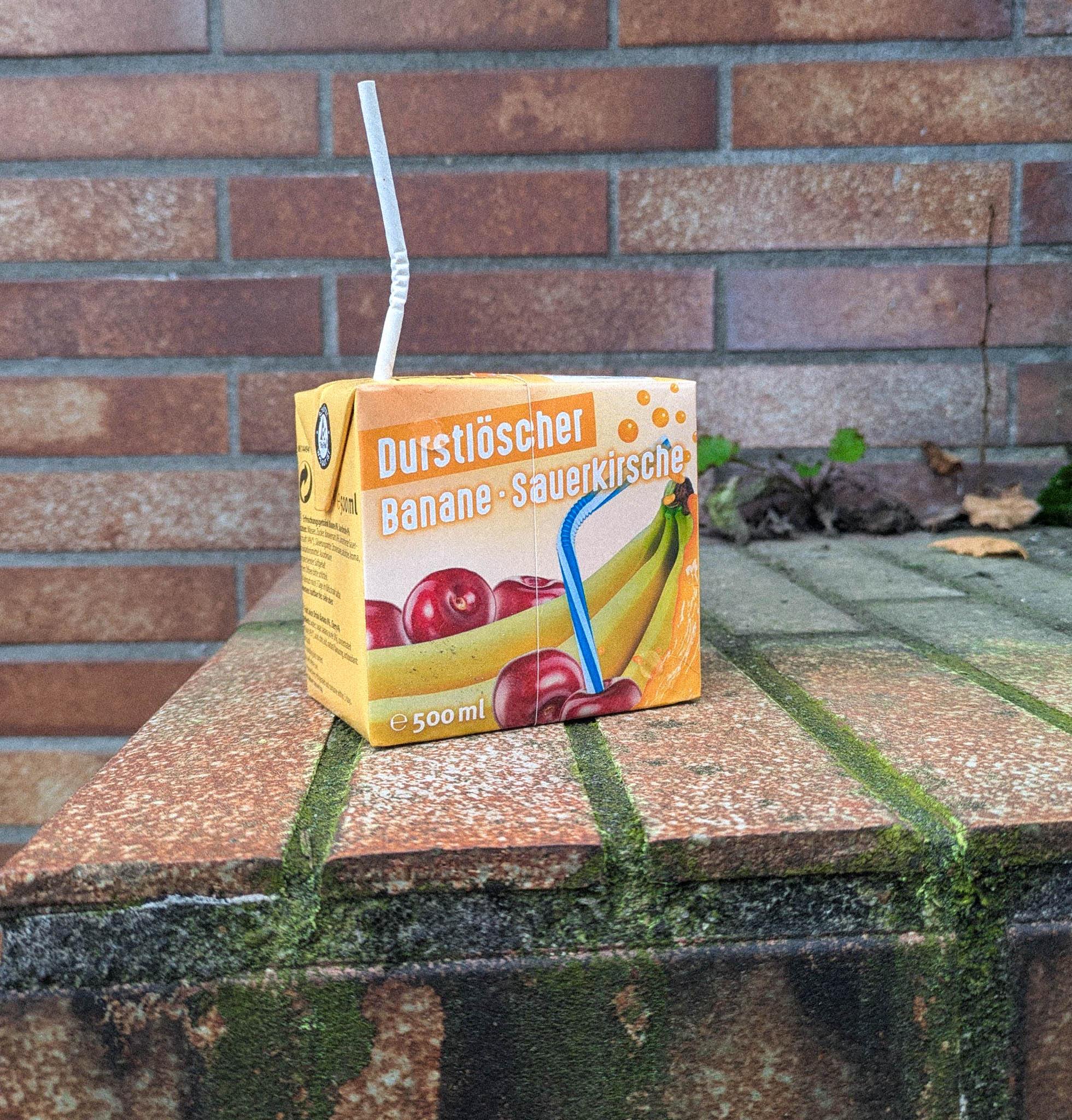 Banana sour cherry on a mossy brick ledge